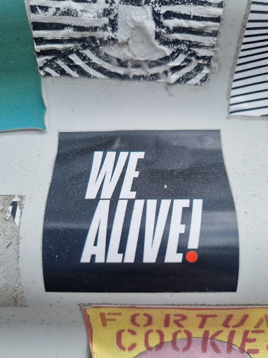 Street sticker Amsterdam WE ALIVE! FORTUN COOKIE