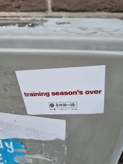 Street sticker A white sticker with the text "training season's over" in dark red.  It also contains a Spotify code.