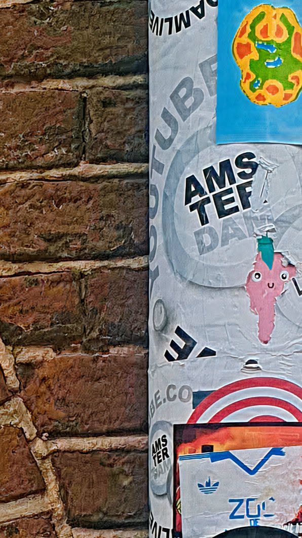 This image shows a close-up of advertisements on a column. There is a pink ice cream cone sticker, a round sticker that reads \"Amsterdam\", and an advertisement with a white background and blue and orange details.