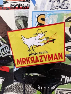 Yellow sticker featuring a cartoon bird wearing a sombrero, holding a spray can and paintbrush.  Text on the sticker says "pintureria MRKRAZYMAN".
