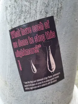Street sticker Sticker featuring a quote from Igor Paskar's final court statement. He was sentenced to 8.5 years in prison for an action against Russian military aggression in solidarity with Ukrainians. The sticker shows two bomb illustrations.