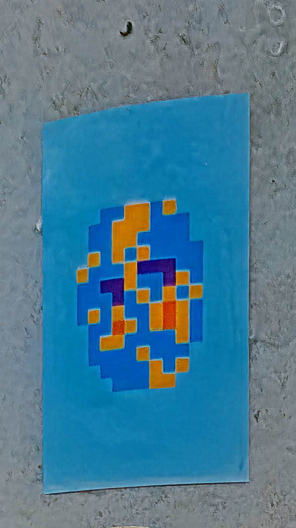 A pixelated design on a rectangular blue canvas. The design is an oval shape made up of blue pixels with orange and purple pixels scattered throughout.