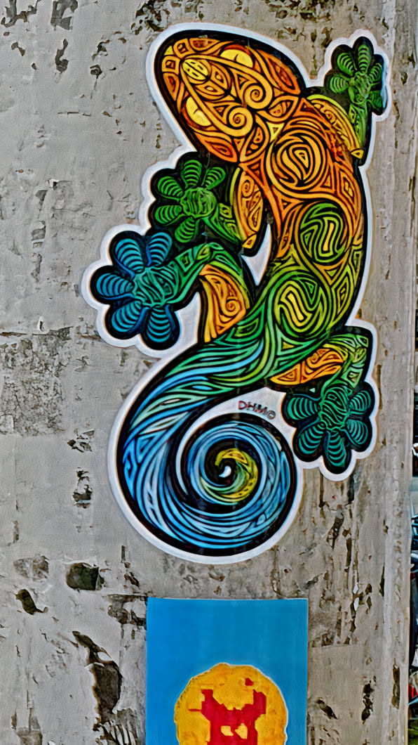 This sticker depicts a lizard with an artistic design. The head is yellow and transitions to orange, then green, and finally blue at the tail. The pattern is a swirling design that is both organic and geometric. The text 'DHMO' is visible near the tail of the lizard.