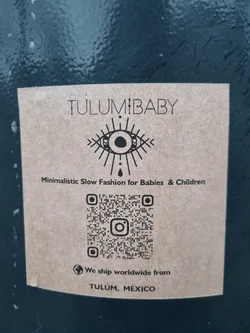 Street sticker Brown sticker with the logo of Tulum Baby, including an eye symbol and a QR code linking to their Instagram.  They ship worldwide from Tulum, Mexico.
