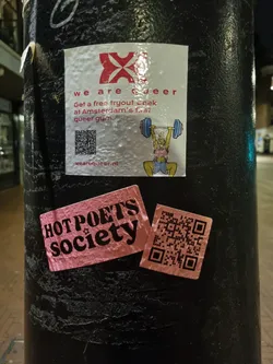 Street sticker Pink sticker with the text Hot Poets Society and a QR code.  There is another sticker above it advertising a free tryout week at Amsterdam's queer gym.