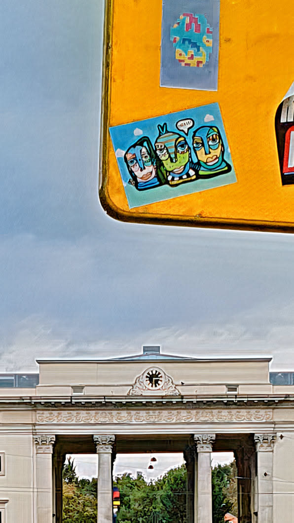A sticker with three stylized figures on a blue background, adhered to a yellow surface. The figures have unique facial features and one has a speech bubble that says 'HELLO!!'.