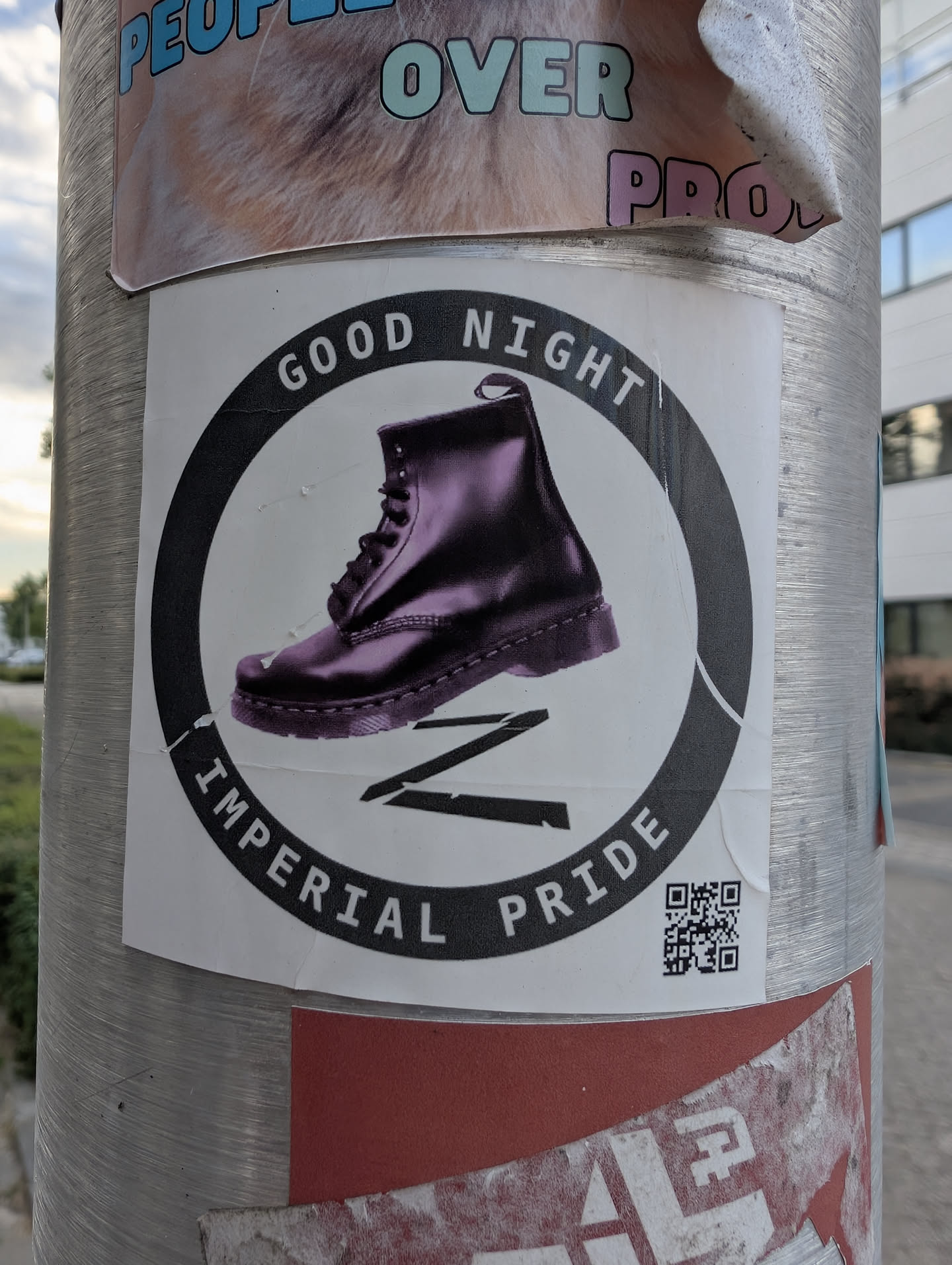 A square white sticker featuring a circular black emblem. Inside, a purple combat boot is positioned above a black 'Z' symbol. The circular border contains the text 'GOOD NIGHT' and 'IMPERIAL PRIDE' in white. A small QR code is located in the bottom right corner.
