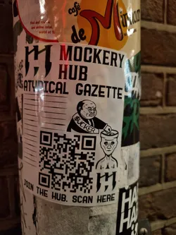 Street sticker A sticker featuring the logo for the Mockery Hub, a satirical publication. The sticker includes a QR code that directs users to join the hub.