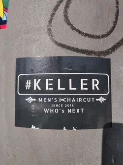 Black and white sticker with the text #KELLER, Men's Haircut, Since 2018, Who's Next. 