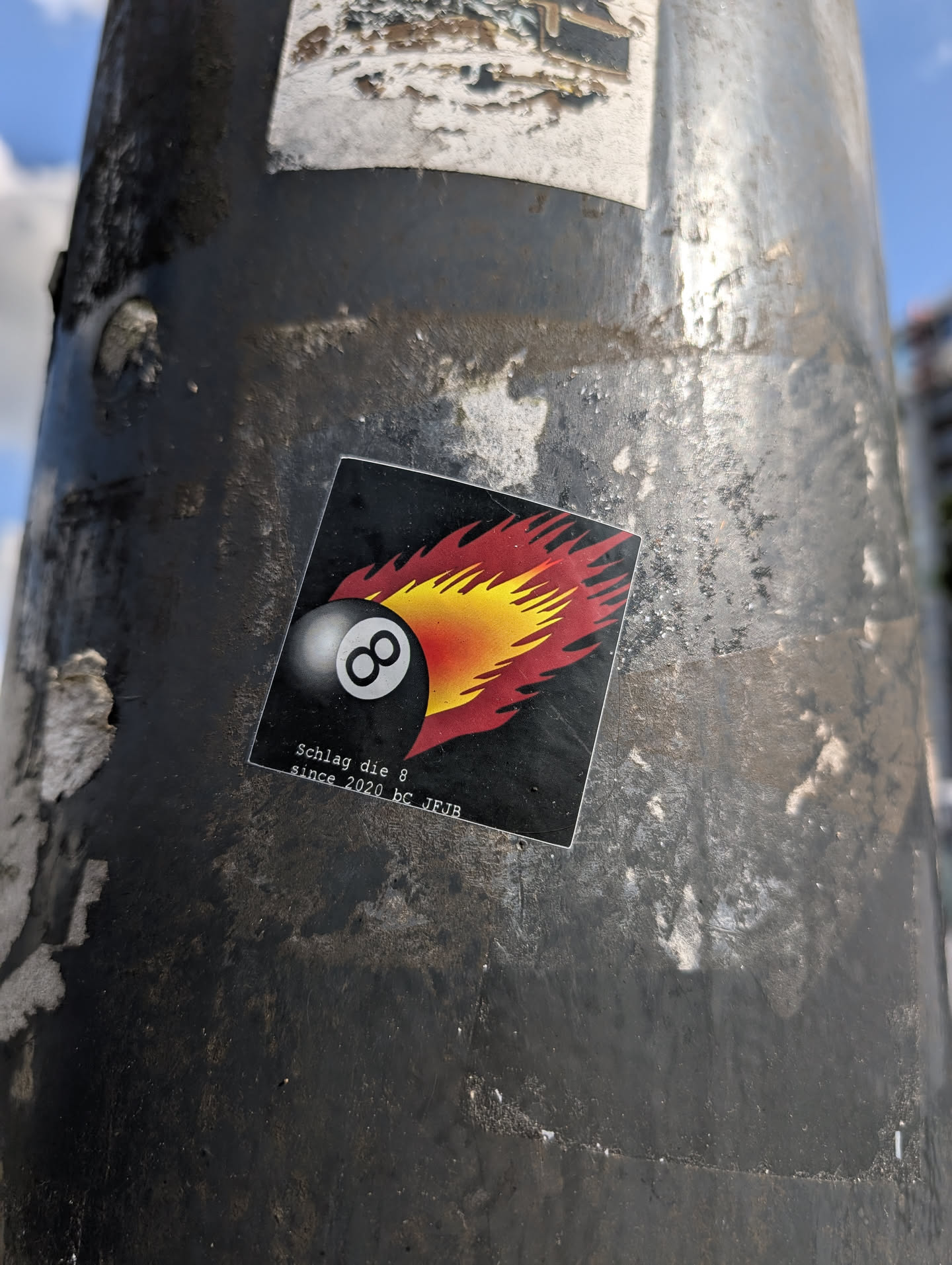 Street sticker This sticker shows an 8-ball with flames emanating from it on a black square background. The text "Schlag die 8 since 2020 bc JFJB" is printed at the bottom of the sticker.