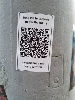 Street sticker A sticker with a QR code and a message asking for satoshis to help prepare for the future.