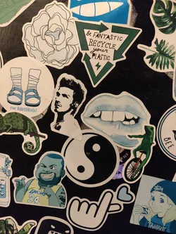 Street sticker A green triangular sticker with the text "Be Fantastic Recycle Your Plastic" and a recycling symbol. 