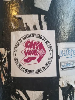 Circular sticker with the text 'Roest' in a stylized font, dates, and a QR code.  It appears to be an event announcement for Roest in Amsterdam on May 7th, 2022.