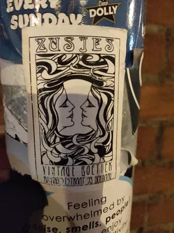 Street sticker Black and white sticker with an art deco design featuring two women's faces. The text on the sticker says "ZUSJES" at the top and "VINTAGE BOETIEK" at the bottom.  There's also some illegible smaller text under the shop name. 