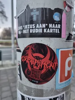 Red and black sticker with the word experiment in a stylized font. It includes a QR code at the bottom. The background is dark with red accents.