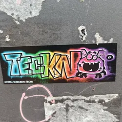 Street sticker A vibrant sticker featuring the word "TEKNO" in graffiti style with a rainbow color scheme. A cartoonish bug with a large grin is positioned to the right of the text. The sticker has a black background and includes a URL at the bottom.