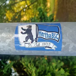 A sticker featuring the Hertha BSC logo. The logo includes a bear standing on its hind legs, a blue flag with the text "Hertha BSC", and a banner with the date "25. Juli 1892".