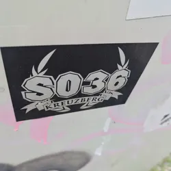 Street sticker Black and white sticker with the number SO36 and the word Kreuzberg in a stylized design. The number is in bold, uppercase letters, and the word Kreuzberg is written in a banner below.