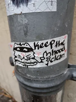 Street sticker A sticker featuring a cartoon illustration of a creature with a crown and a mustache, along with the text 'Keep the hood clean'.
