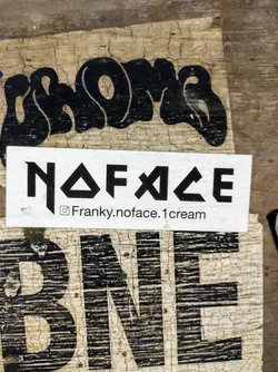 A white sticker with black text. The text says NOFACE in a stylized font. Underneath, there's an Instagram handle: @Franky.noface.1cream