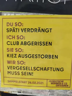 Street sticker A yellow sticker with text in German.  It seems to be a protest or activist sticker related to gentrification and the loss of community spaces.  The text translates roughly to: "You: displaced Späti (late-night store); Me: club demolished; They: neighborhood extinct; We: Expropriation must be!"