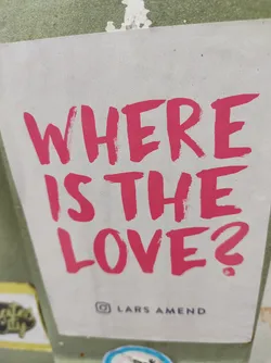 Street sticker A sticker with the text 'Where is the love?' written in a pink brush script.  The Instagram handle @larsamend is visible at the bottom.