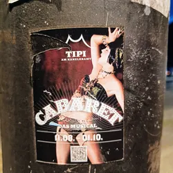 Street sticker A sticker advertising the musical Cabaret playing at the Tipi am Kanzleramt from August 11th to October 1st.  The sticker features an image of a showgirl in a cabaret style pose. A QR code is also present.