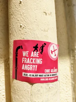 Street sticker A pink sticker with black text and illustrations protesting against fracking.  It includes the website www.ende-gelaende.org and dates for a mass action.