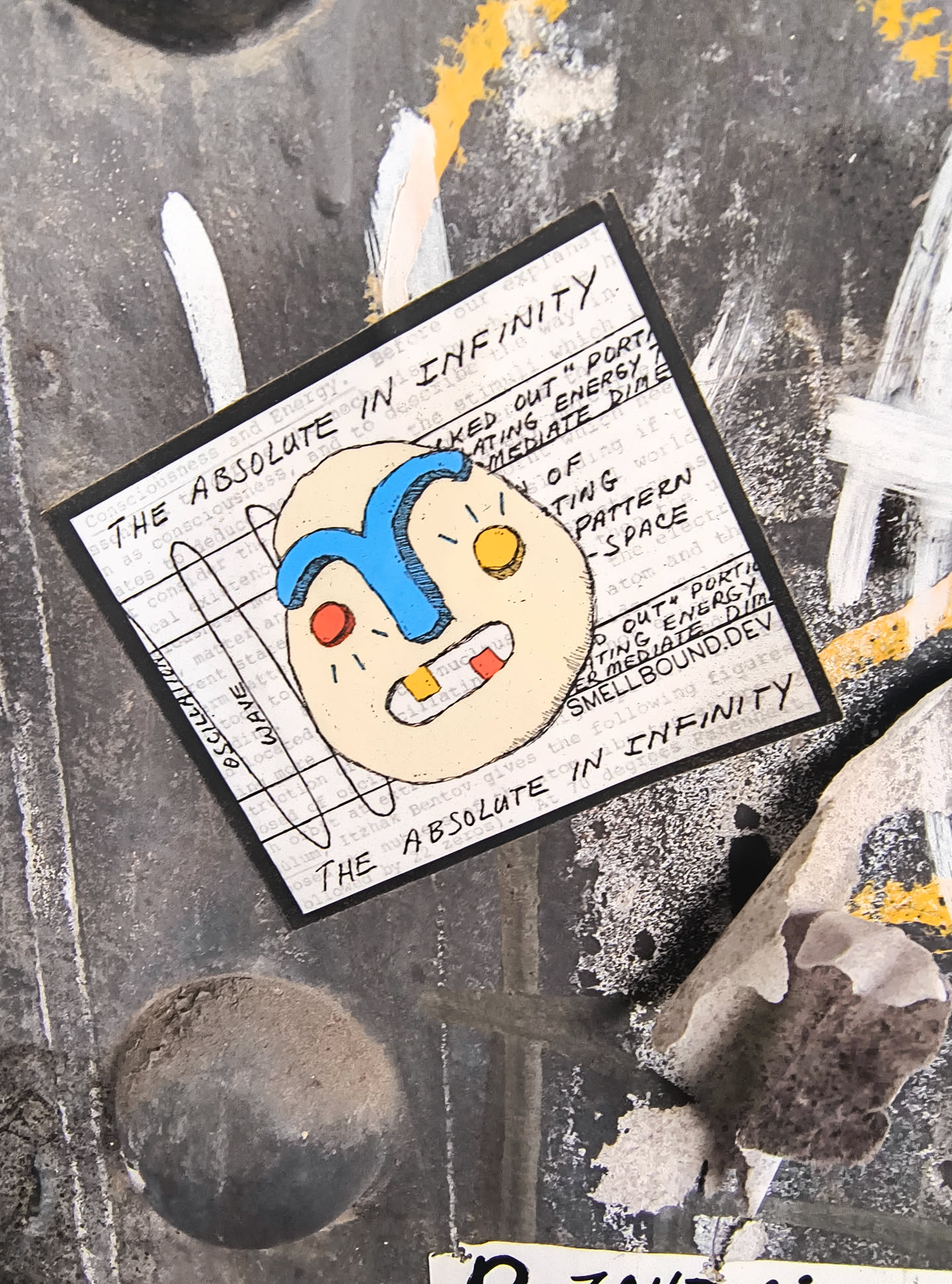 Street sticker The sticker is rectangular with a black border. The background is filled with dense, small-print text. Centered on the sticker is a stylized, abstract face with a light beige skin tone. The face has a prominent blue curved shape over its forehead, resembling a stylized eyebrow or hair. It has two small red circles for cheeks or blemishes, and two yellow circles for eyes. The mouth is open, revealing a red tongue and a single white tooth with a yellow rectangle above it, possibly representing another tooth or detail. The drawing style is simple and bold, with visible black outlines. Overlaying the text and the face are two thin black curved lines, one creating a circular arc and another a more diagonal, angular shape.