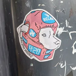 A sticker featuring a dog wearing a pink helmet with "Relax" written on it and a digital clock displaying 4:20. The artist's Instagram handle is @Aleph.Hoodz.