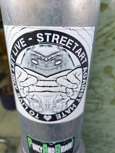 Street sticker STREETART 7 a - @levveunlevvelosse &gt; AGAINST LET LIVE HATE AND LIVE TO I