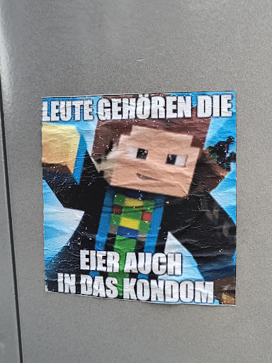 A sticker featuring a Minecraft character and a German meme-like phrase. The text translates to something like: "People belong the eggs also in the condom."