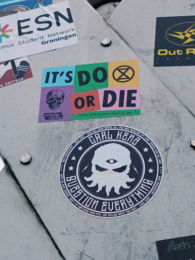 Street sticker ESN Student Network Groningen must Out R terraza IT'S a DO OR DIE extinction rebellion www.extinctionrebellion.de WHAT ПОЛ YOU. NMO AOA ARE! CARL KENE GARL ANYTHING LET 1.NOO ARSVIVENDA.COM TRENDS. INTO BE DON'T BE INTO TRENDS. DON'T LET ANYTHING OWN EUERYTHING YOU. YOU DECIDE WHAT KENZ ARSVIVENDA.COM DON'T AAA YOU ARE! CARL Late