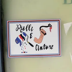 Street sticker A sticker featuring a paint roller with dripping paint and a muscular arm holding a belt. The text "Rulli & Cinture" is prominently displayed, suggesting a business related to painting and belts.