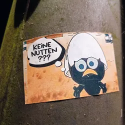 Street sticker A sticker featuring a cartoon character with a thought bubble saying "Keine Nuten???" which translates to "No nuts???" in German. The character looks concerned. The art style is reminiscent of a comic book.