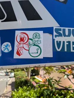 Street sticker Square white sticker with red and green graphics. Includes a beer mug, a smoking joint, a compass rose, and Legia Warszawa fan symbols. Text reads 'ON TOUR' and 'Białołęka'.