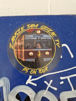 Street sticker Round sticker featuring an illustration of a train and the text "Zawsze tam gdzie ty" which translates from Polish to "Always where you are" and "PS on tour" at the bottom. The sticker is on a blue background.