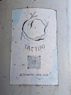 Street sticker Rectangular sticker featuring a minimalist black line drawing of an organic sphere. Includes the word 'TATTOO', an Instagram QR code, and the handle '@JENNIFER_SOZE.SOZE' on a light blue and white background.