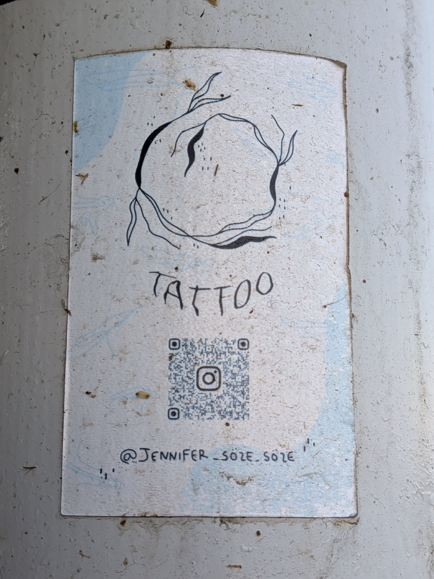 Rectangular sticker featuring a minimalist black line drawing of an organic sphere. Includes the word 'TATTOO', an Instagram QR code, and the handle '@JENNIFER_SOZE.SOZE' on a light blue and white background.