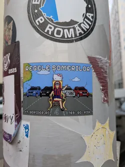 Street sticker A rectangular pixel-art style sticker. It features a character in a red and blue striped jersey sitting on a golden throne topped with a Hello Kitty head. Four cars are lined up behind the throne on a two-lane road under a blue sky. Pixelated text is displayed at the top and bottom.