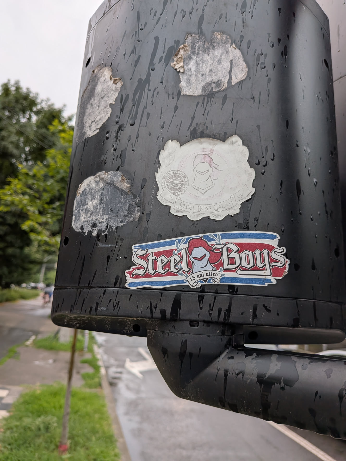 A faded, die-cut white sticker featuring a central knight's helmet crest. It includes a circular emblem on the left and a banner at the bottom reading 'STEEL BOYS GALATI' flanked by the year '2006'.