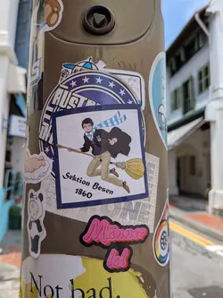 Street sticker Square sticker with a blue border showing a cartoon boy in a blue-and-white scarf riding a broomstick. Features the German text 'Sektion Besen 1860' at the bottom.