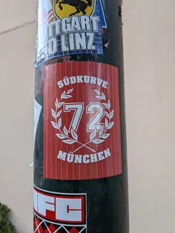 A rectangular red sticker with white pinstripes, featuring the text 'SÜDKURVE' and 'MÜNCHEN' surrounding a central '72' inside a laurel wreath.