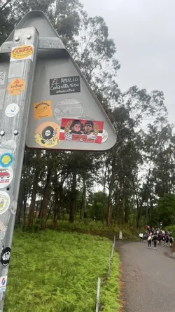 Street sticker A rectangular sticker featuring a red and white striped background, reminiscent of the Argentine flag. On the left, it depicts Hasbulla Magomedov, and on the right, Diego Maradona, both from the chest up. The figures are framed by golden laurel wreaths on either side. Below them, white text with a red outline reads 'Los DIOSES están con NOSOTROS'.