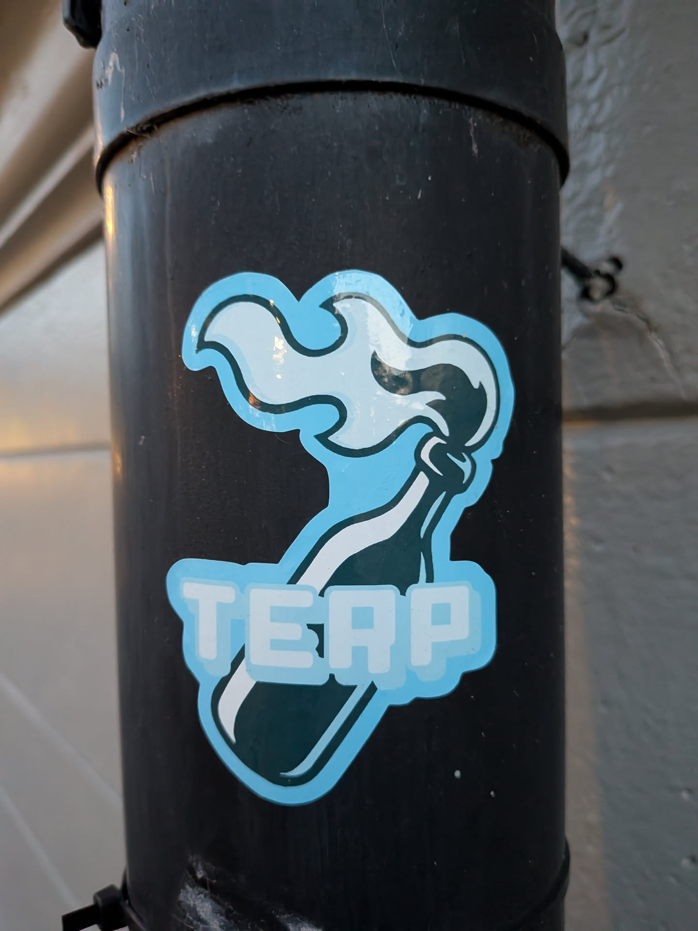 The sticker features a stylized representation of a Molotov cocktail. The bottle is depicted in dark teal with a white label and a white wick. Emerging from the bottle's opening is a plume of light blue and white smoke or flame, outlined in dark teal. Below the bottle, the word 'TERP' is prominently displayed in large, blocky, light blue letters with a white outline and a subtle pixelated effect. The entire design is bordered by a thick, light blue outline.