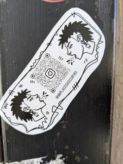 Street sticker This rectangular sticker displays a black and white illustration of two individuals facing each other. The QR code is located in the middle of the sticker. The sticker's design includes bold, graphic lines and a simple aesthetic. There is text along the side of the sticker.