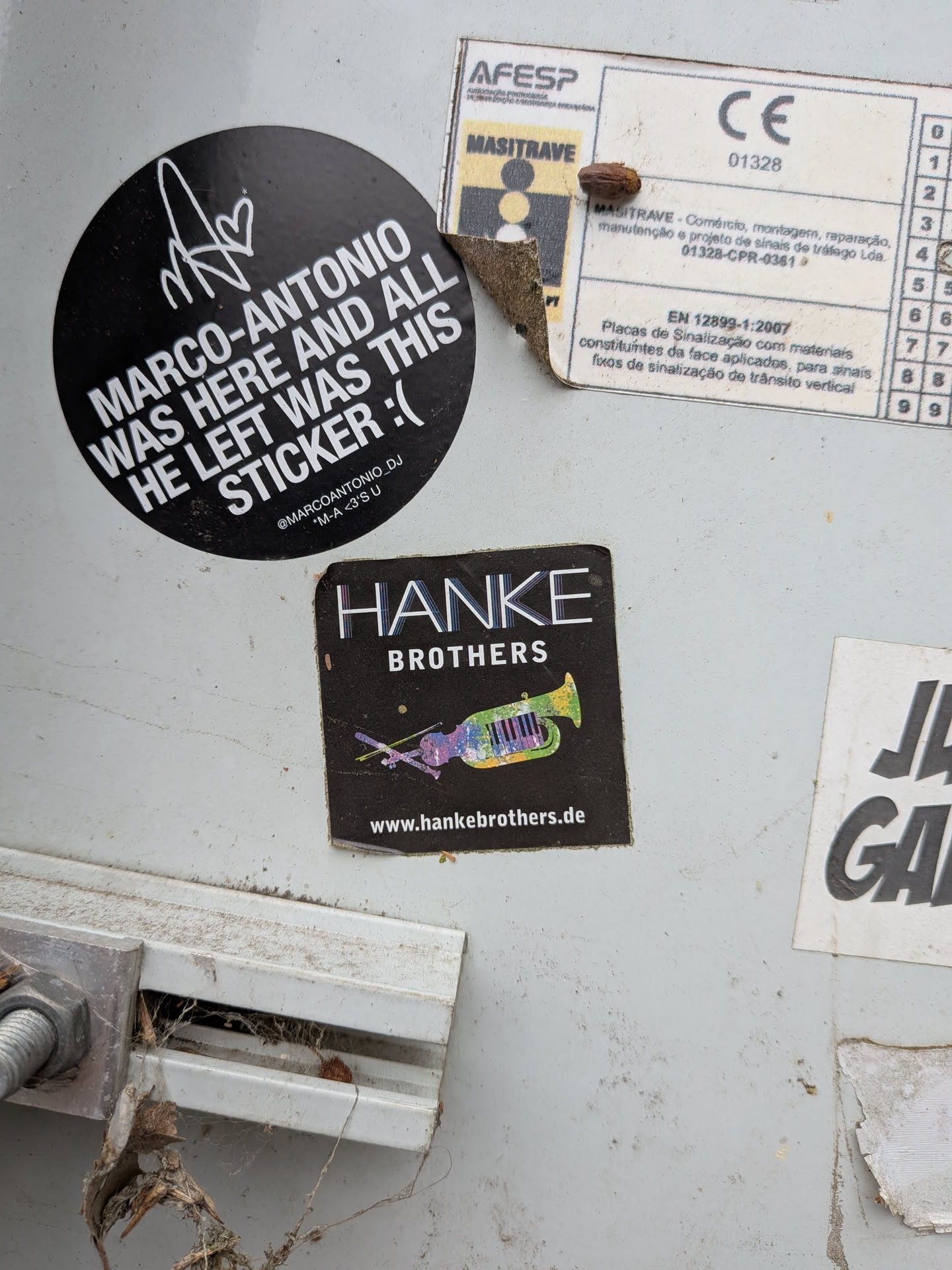A square black sticker featuring the text 'HANKE BROTHERS' in white. Below the text is a colorful, stylized illustration of a hybrid musical instrument combining a violin, trumpet, and piano keys. The website 'www.hankebrothers.de' is printed at the bottom.