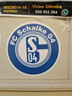 Street sticker A round sticker featuring the logo of FC Schalke 04, a German football club. The logo is predominantly blue and white, with the club's initials and number prominently displayed.