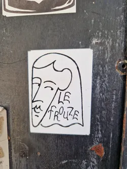 Street sticker A minimalist line drawing sticker depicting a stylized female face with long hair. The text 'LE FROUZE' is written beneath the face.