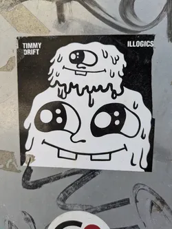 Street sticker This sticker showcases a cartoon character with two heads, rendered in black and white with a melting effect. The design has a playful, slightly grotesque aesthetic. The sticker is adhered to a textured surface.